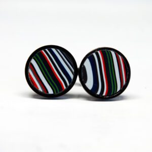 Striped circular cufflinks on white background.