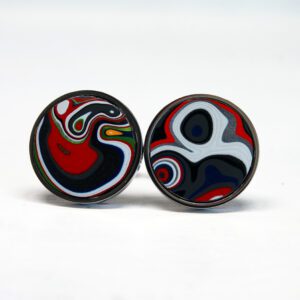 Colorful abstract design cufflinks on display.