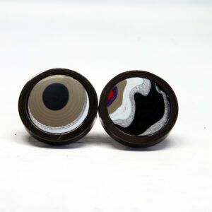 Decorative circular pattern earrings on display.