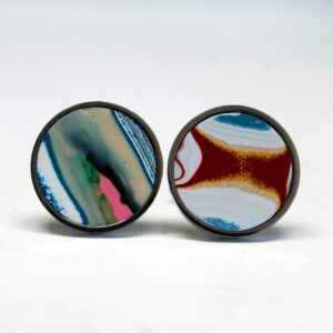 Colorful abstract round earrings on display.