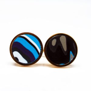 Colorful round earrings with abstract patterns.