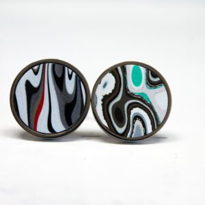 Colorful abstract pattern earrings on display.