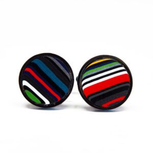 Colorful striped fabric button earrings on white.