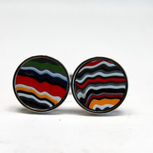 Colorful striped circular earrings on white background.