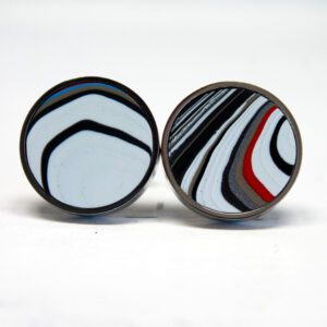 Round earrings with colorful abstract patterns.