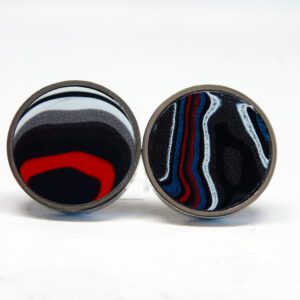Colorful abstract patterned round earrings.