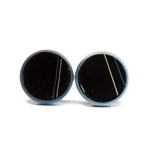 Two round, black cufflinks with stripes.