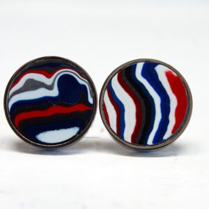Round earrings with colorful abstract patterns.