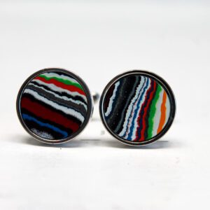 Colorful striped round cufflinks on display.