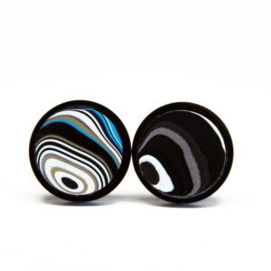 Abstract circular black and white patterns.