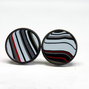 Striped circular earrings with black accents.