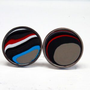Round colorful cufflinks with abstract design.
