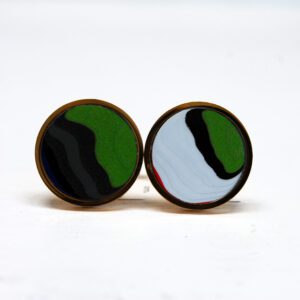 Colorful round stud earrings on white background.