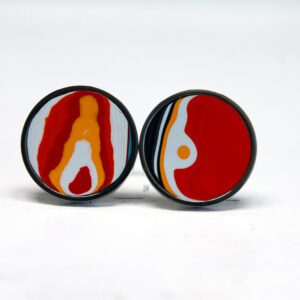 Colorful abstract design on round earrings.