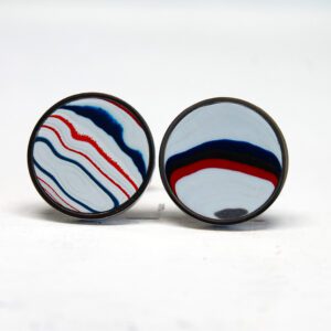 Colorful round earrings with wavy patterns.