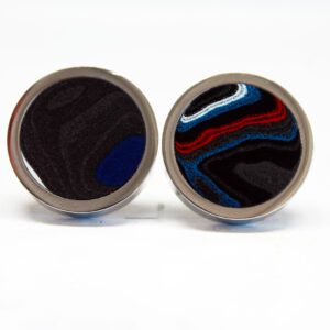 Round cufflinks with abstract colorful design.