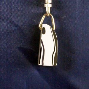 Black and white pendant on blue background.