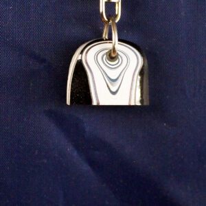 Silver keychain on a dark background.