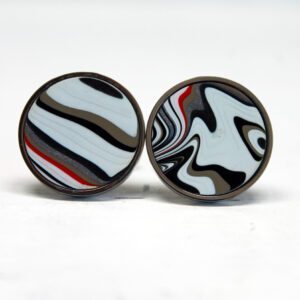 Round earrings with abstract swirl pattern.
