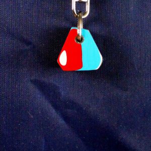 Colorful keychain on dark textured background.