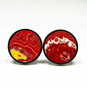 Red and yellow patterned round earrings.