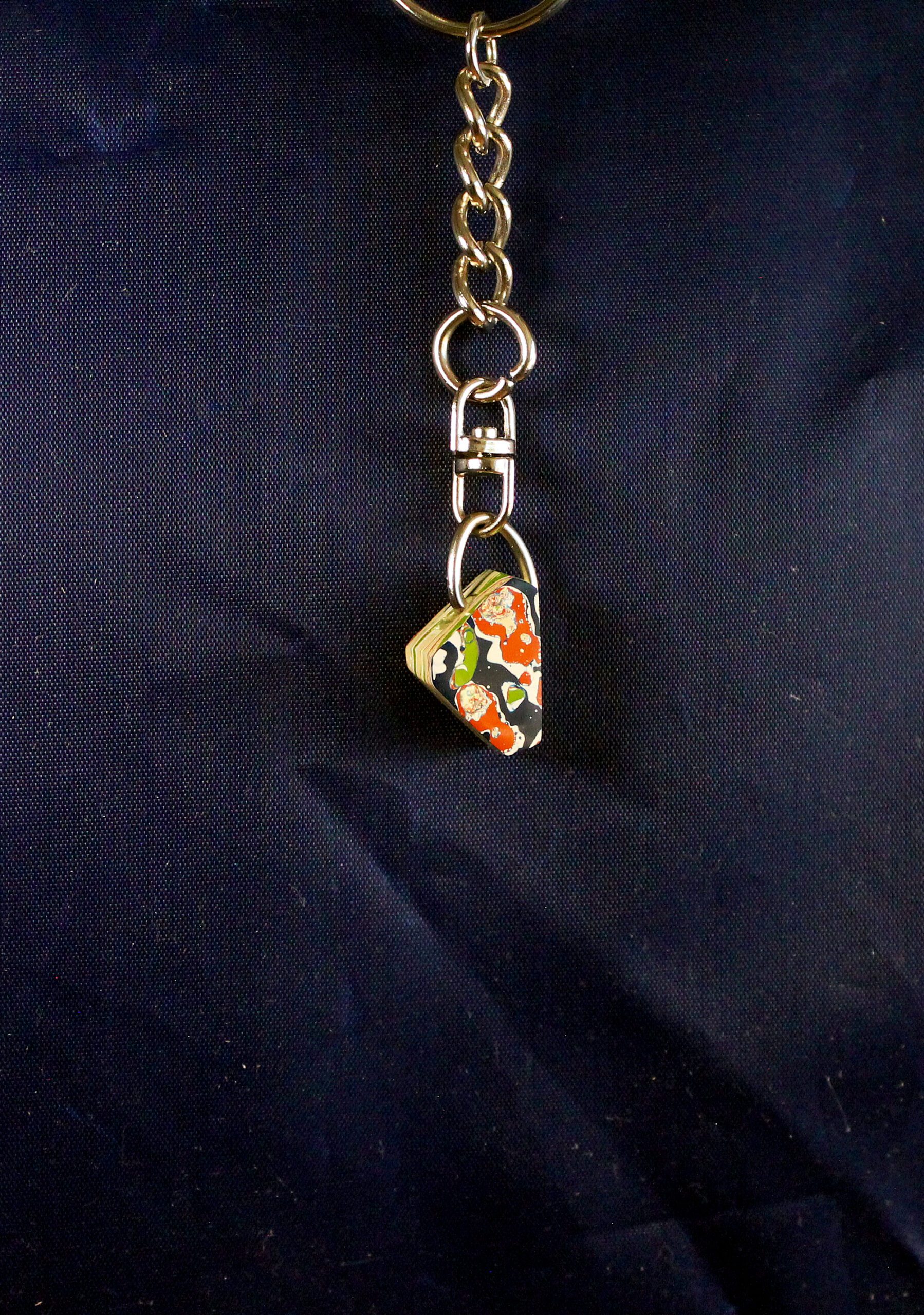 Colorful keychain with patterned pendant.