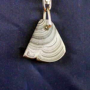 Triangular metallic keychain with swirling pattern.