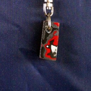 Colorful pendant on a metal keychain.