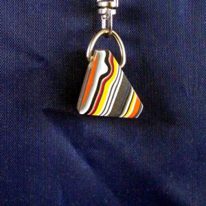 Colorful striped pendant on a keychain.