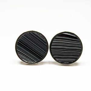 Two round cufflinks with striped pattern.