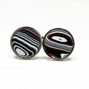Striped round cufflinks with abstract patterns.