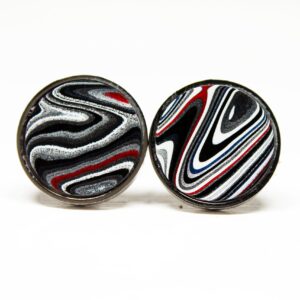 Round earrings with black, red, white swirls.
