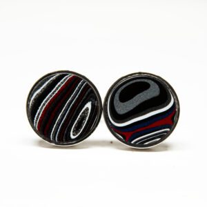 Colorful round cufflinks with abstract patterns.