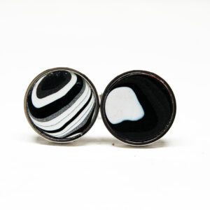 Two black and white patterned cufflinks.