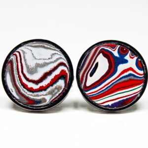 Colorful, abstract design on two circular objects.