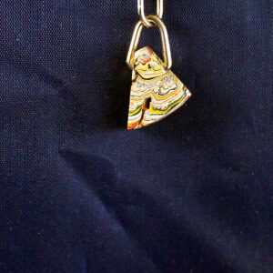 Keychain with colorful, layered paint pendant.