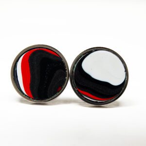 Round earrings with red, black, white design.