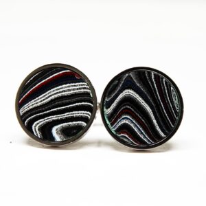 Round cufflinks with abstract striped design.