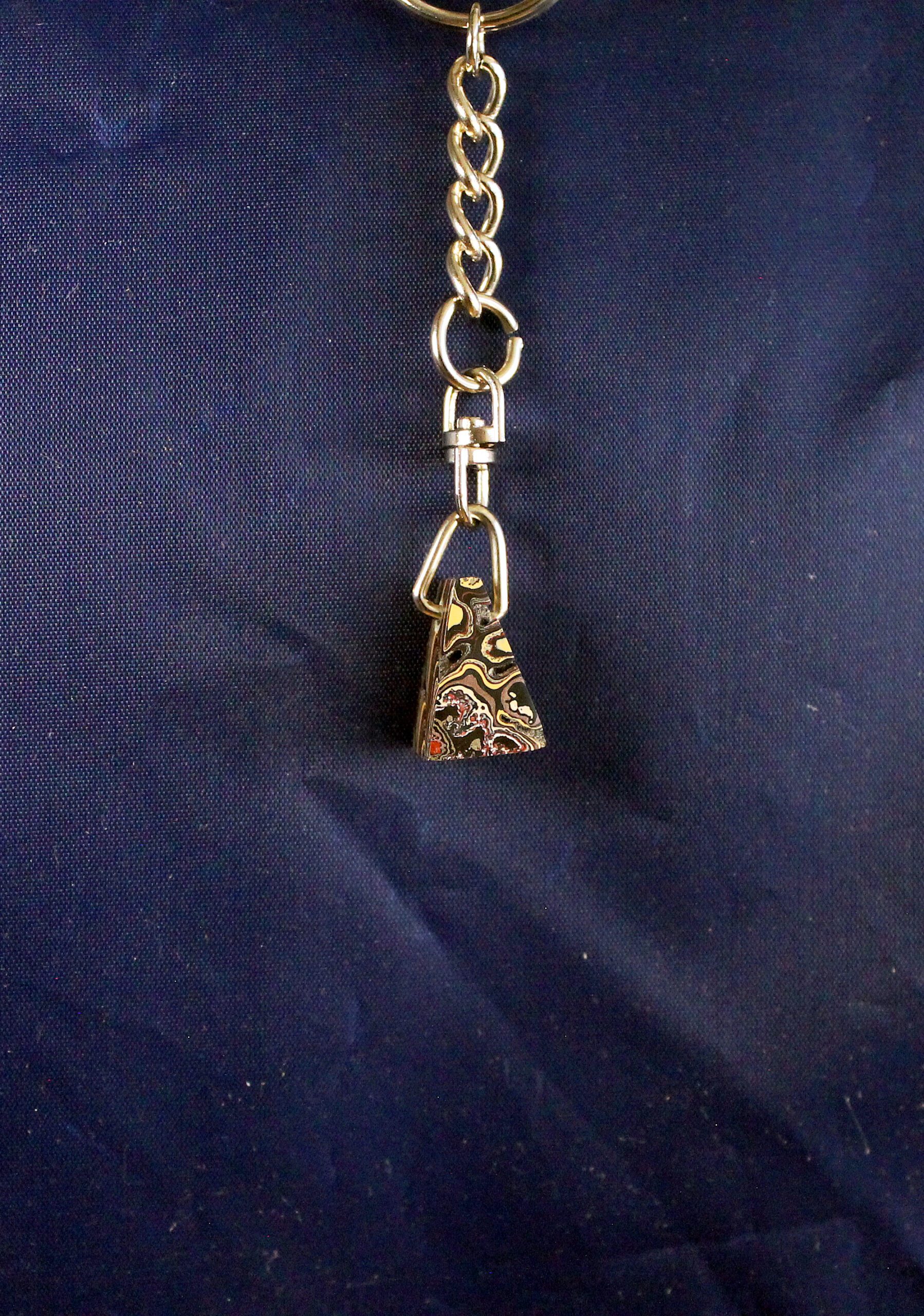 Decorative keychain with ornate metal pendant.