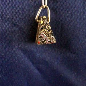 Colorful keychain on a dark blue background.