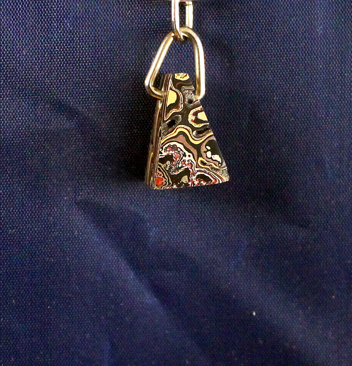 Colorful keychain on a dark blue background.