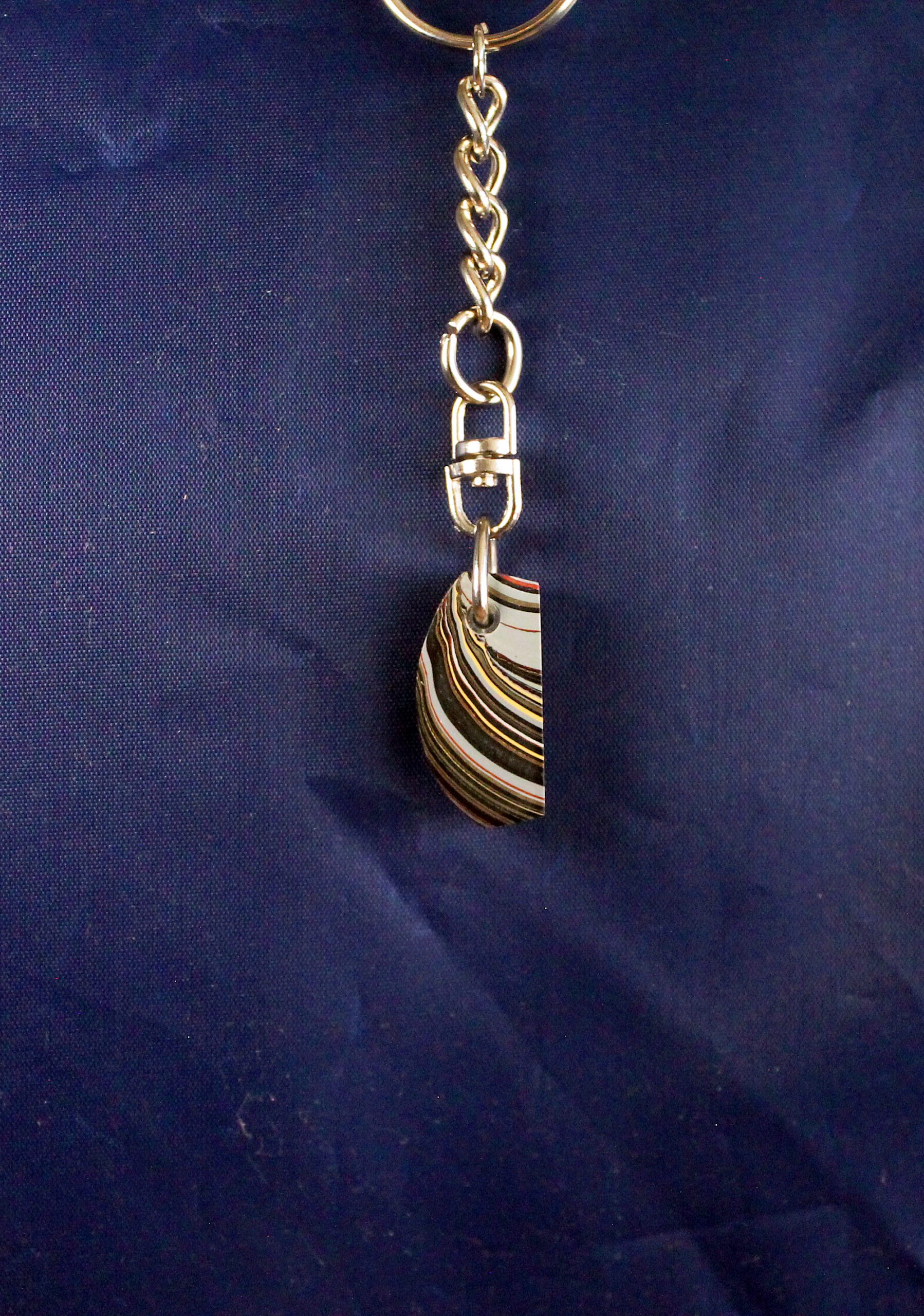 Keychain with striped stone pendant.