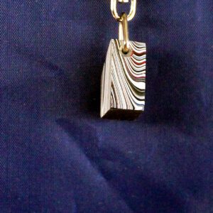 Striped pendant on a blue background.