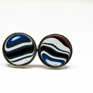Circular earrings with black and white stripes.