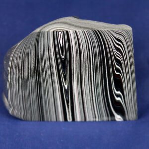 Black and white striped rock on blue.