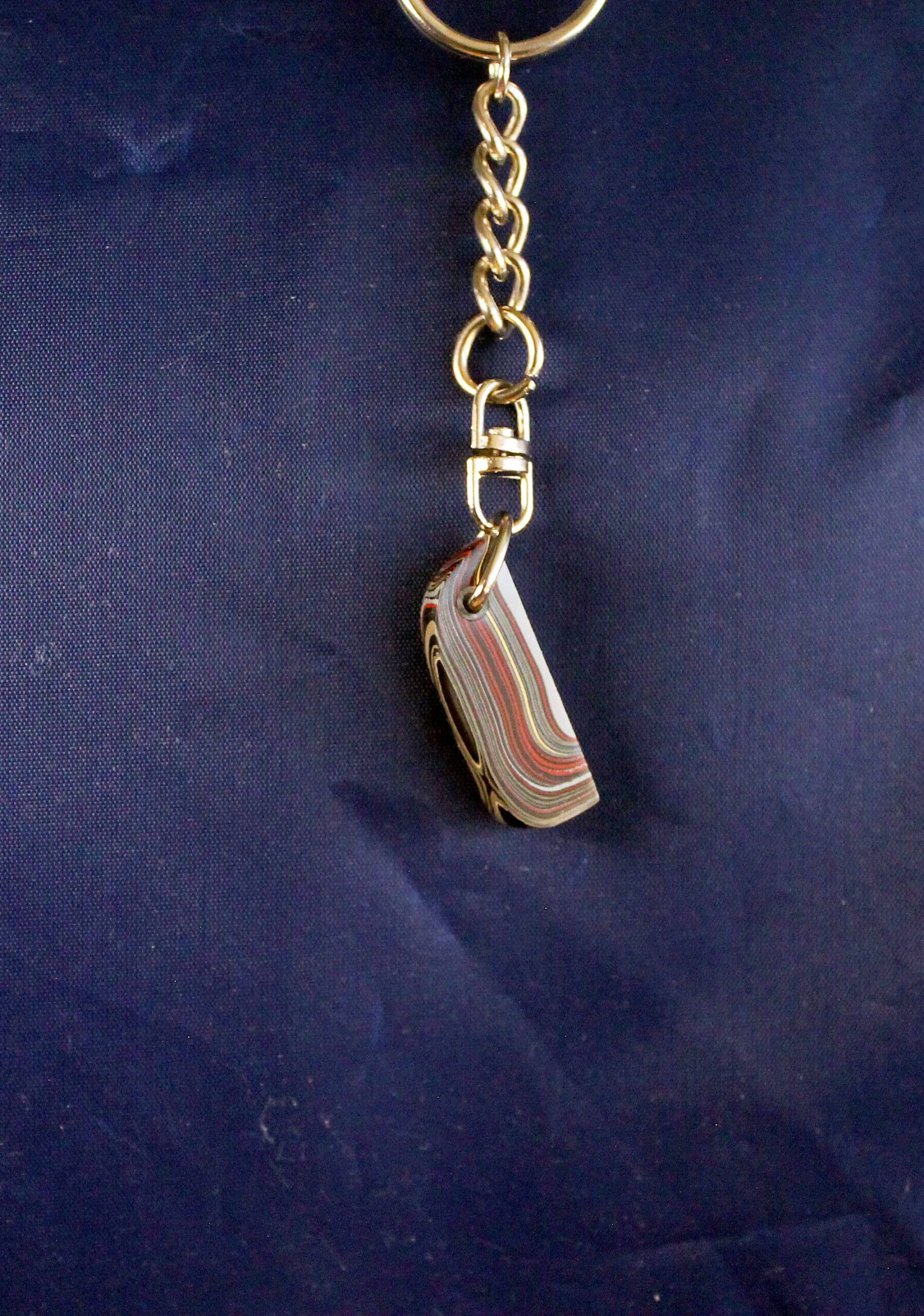 Keychain with colorful layered stone pendant.