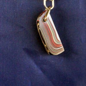 Colorful keychain against a dark background.