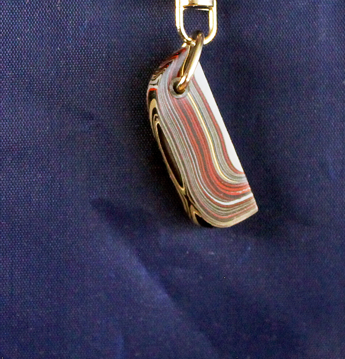 Colorful keychain against a dark background.