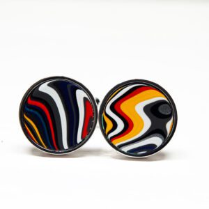 Colorful round cufflinks with swirling patterns.