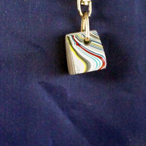 Colorful keychain on a blue background.